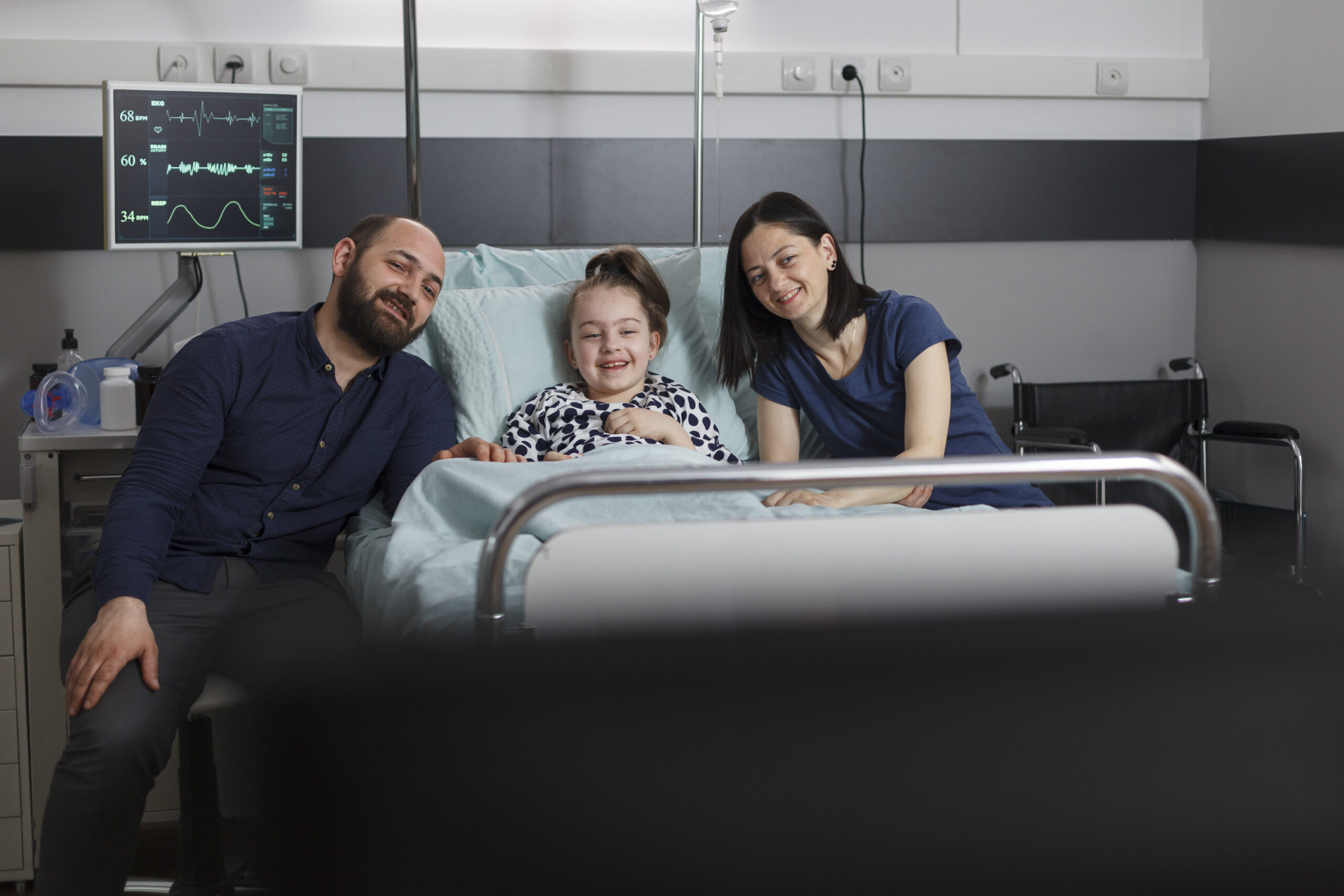 Smiling child in hospital with family – FAQs about Complex Wound Care at Connectors Wellbeing